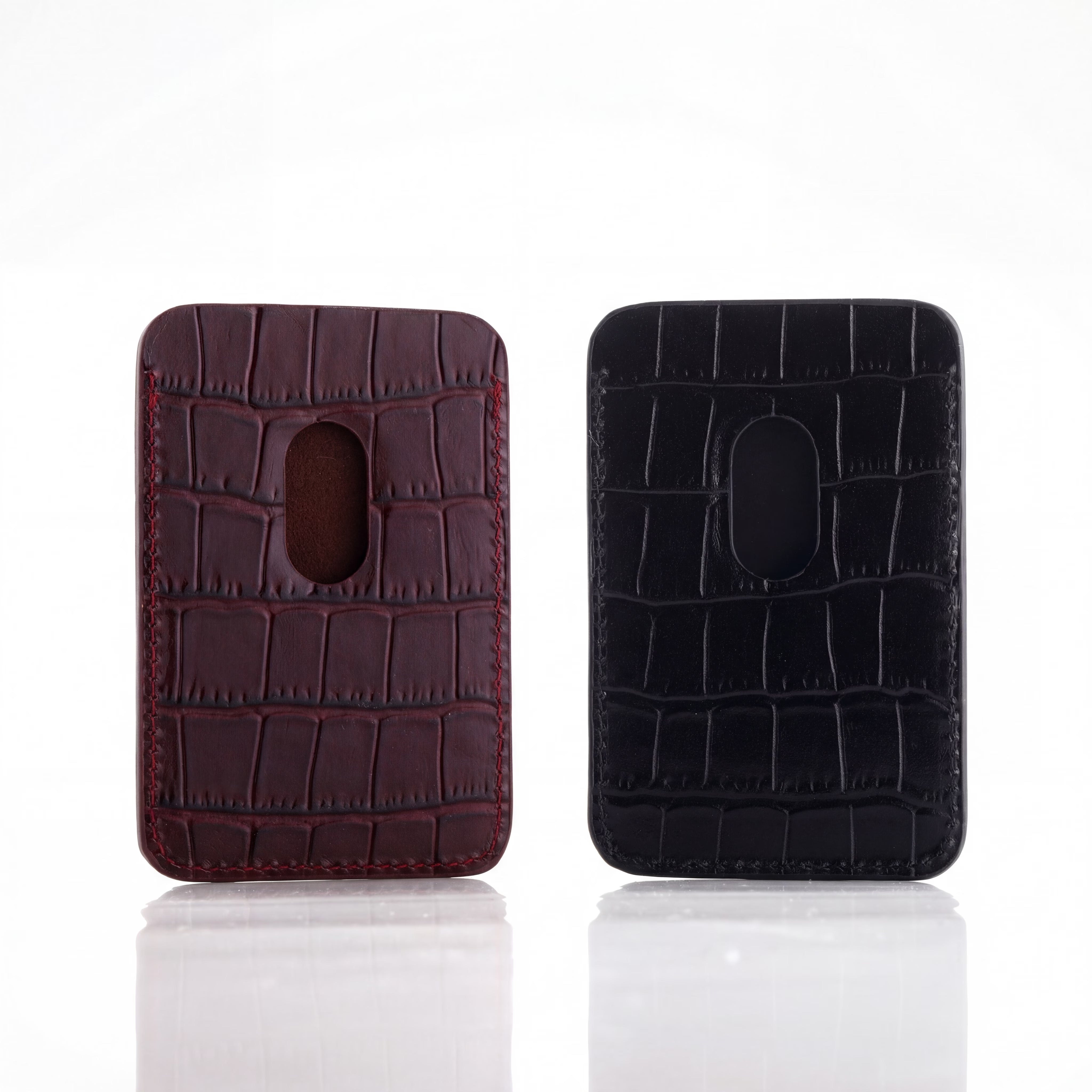 MagSafe Cardholders two crocodile-textured one burgundy and one black, on a white background.